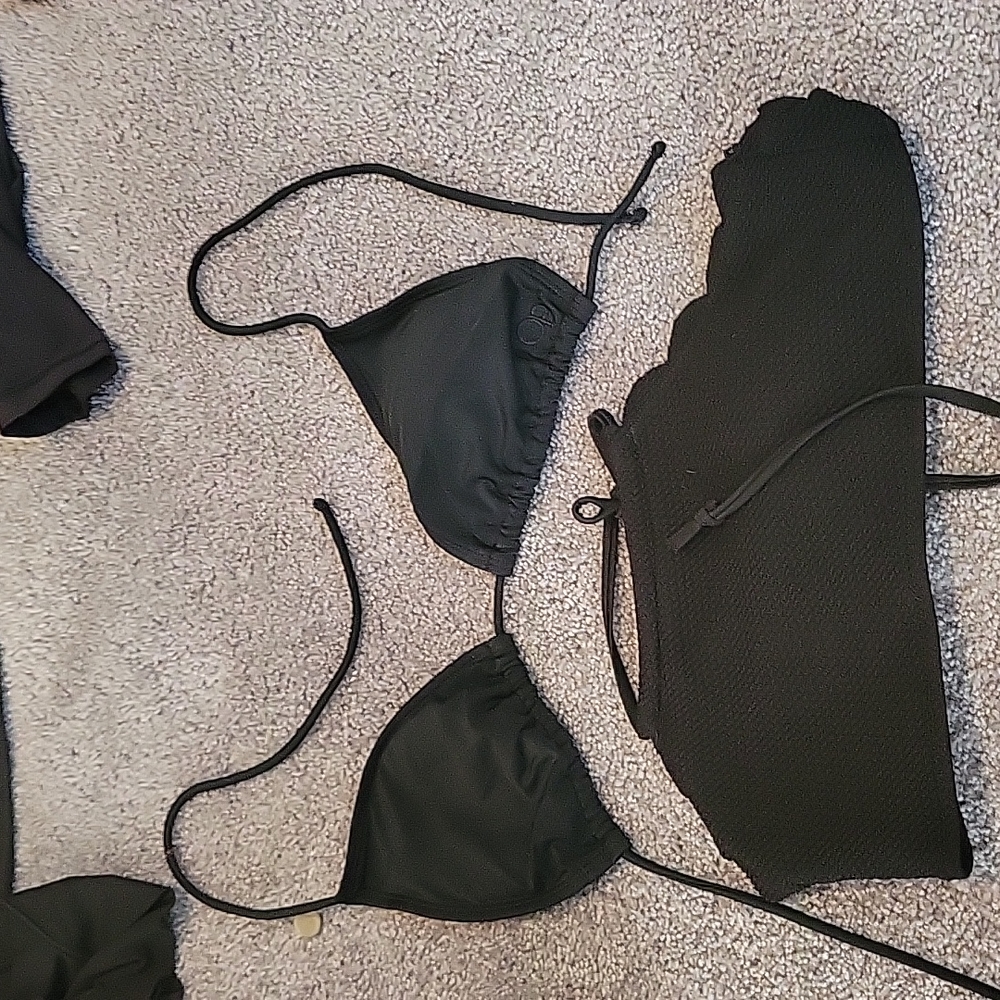 Two black swim suit tops
